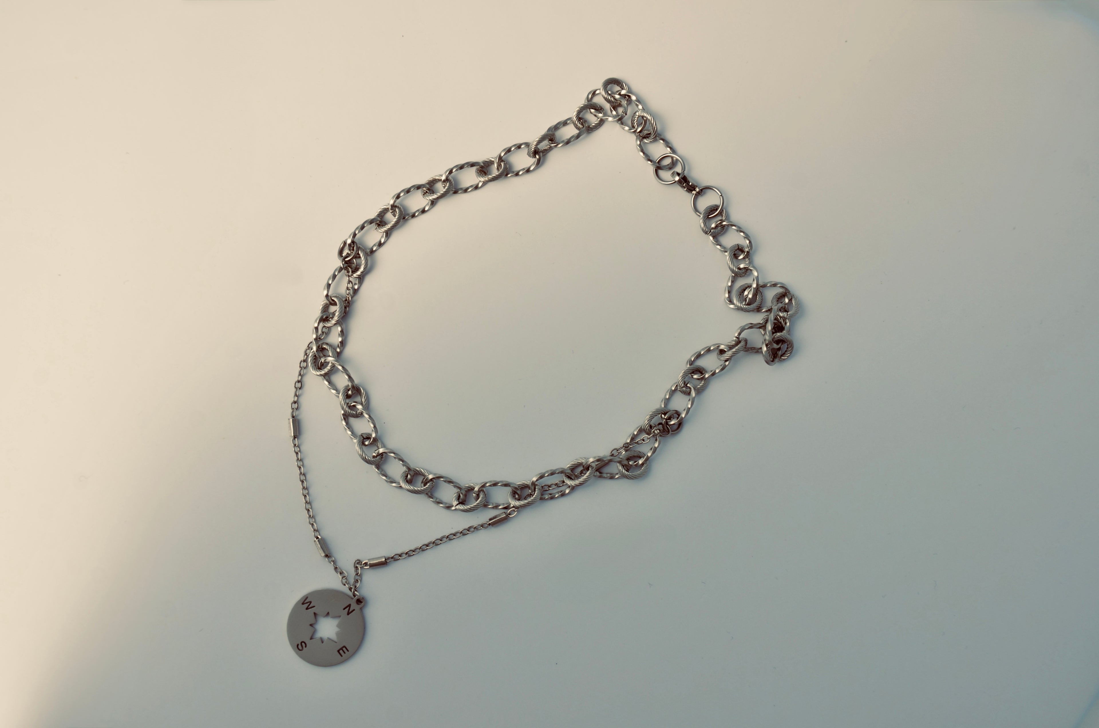Chunky rolo chain choker necklace with a compass pendant
