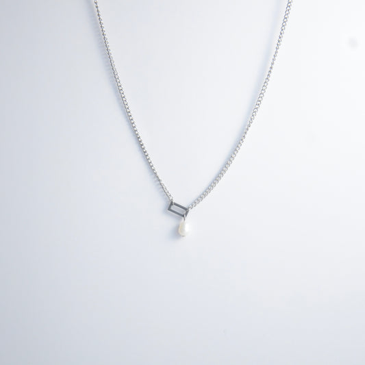 Silver necklace with a geometric shape and pearl pendant