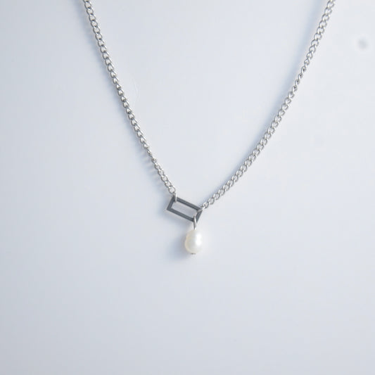 Silver necklace with a geometric shape and pearl pendant