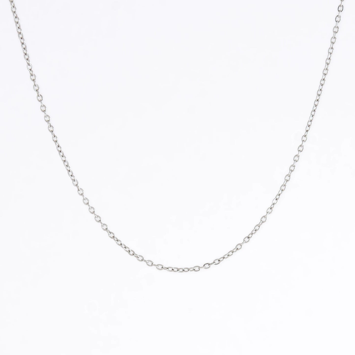Silver stainless steel dainty chain necklace on a light gray background