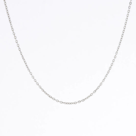 Silver stainless steel dainty chain necklace on a light gray background