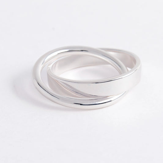 Silver ring on a light gray background