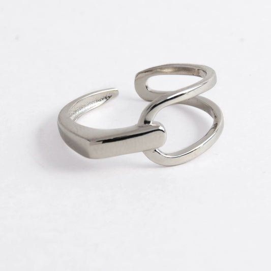Geometric sterling silver ring on a light gray background