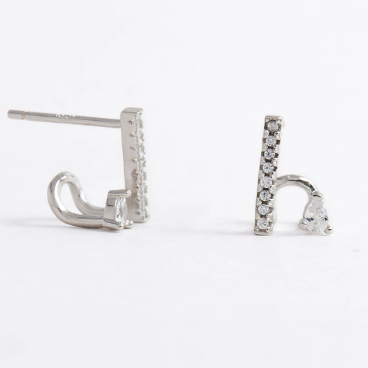 Pair of silver bar earrings on a light gray background