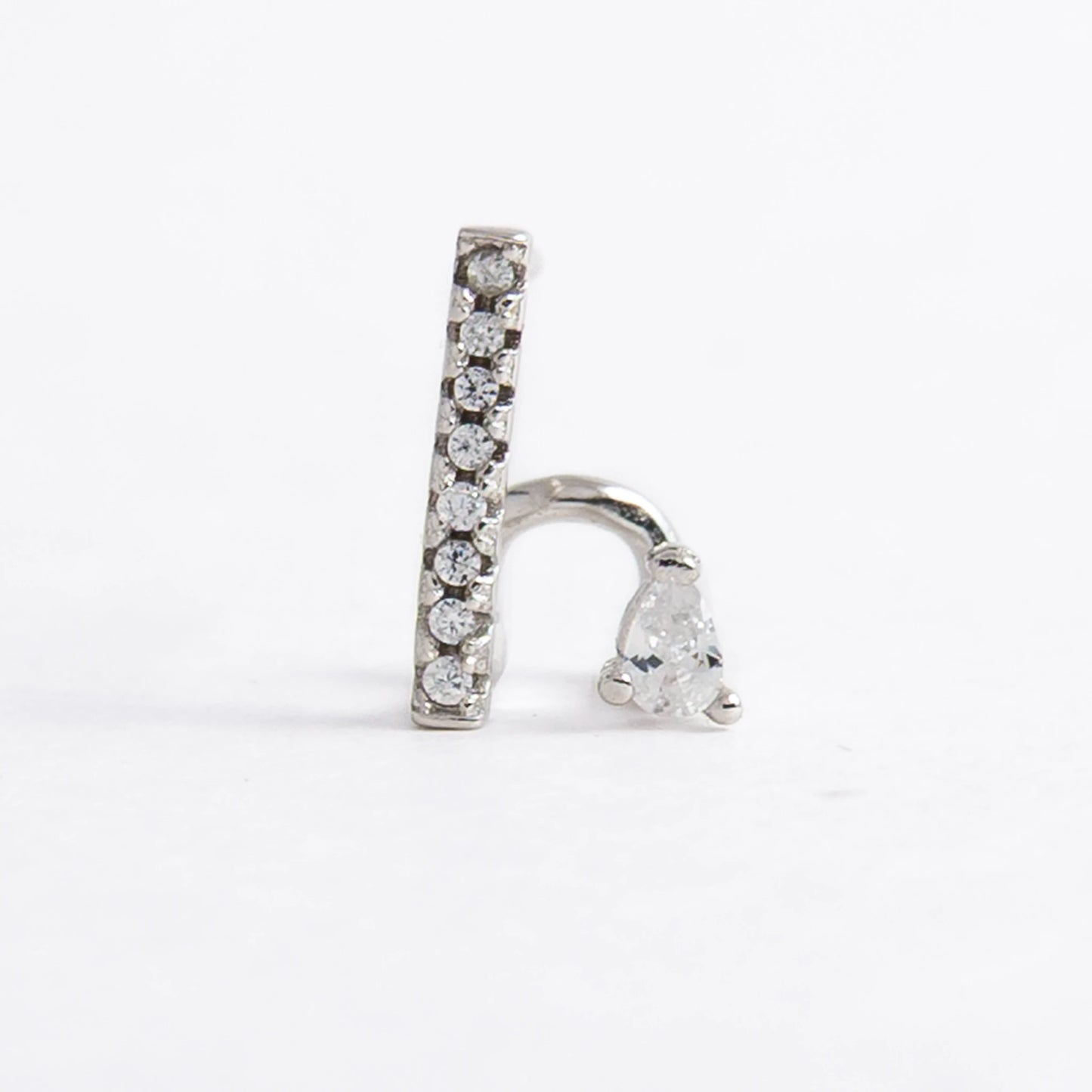 Pair of silver bar earrings on a light gray background