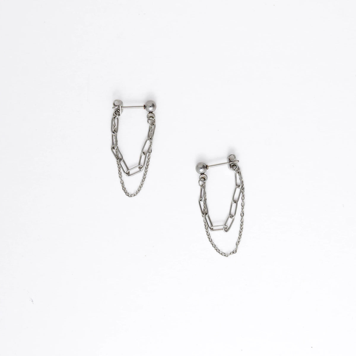 Pair of silver chain earrings on a white background
