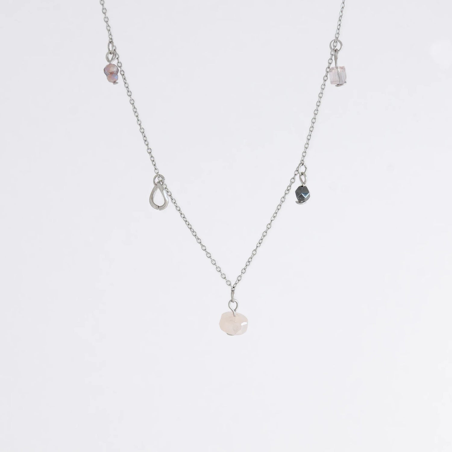 Silver charm bracelet on a dainty chain