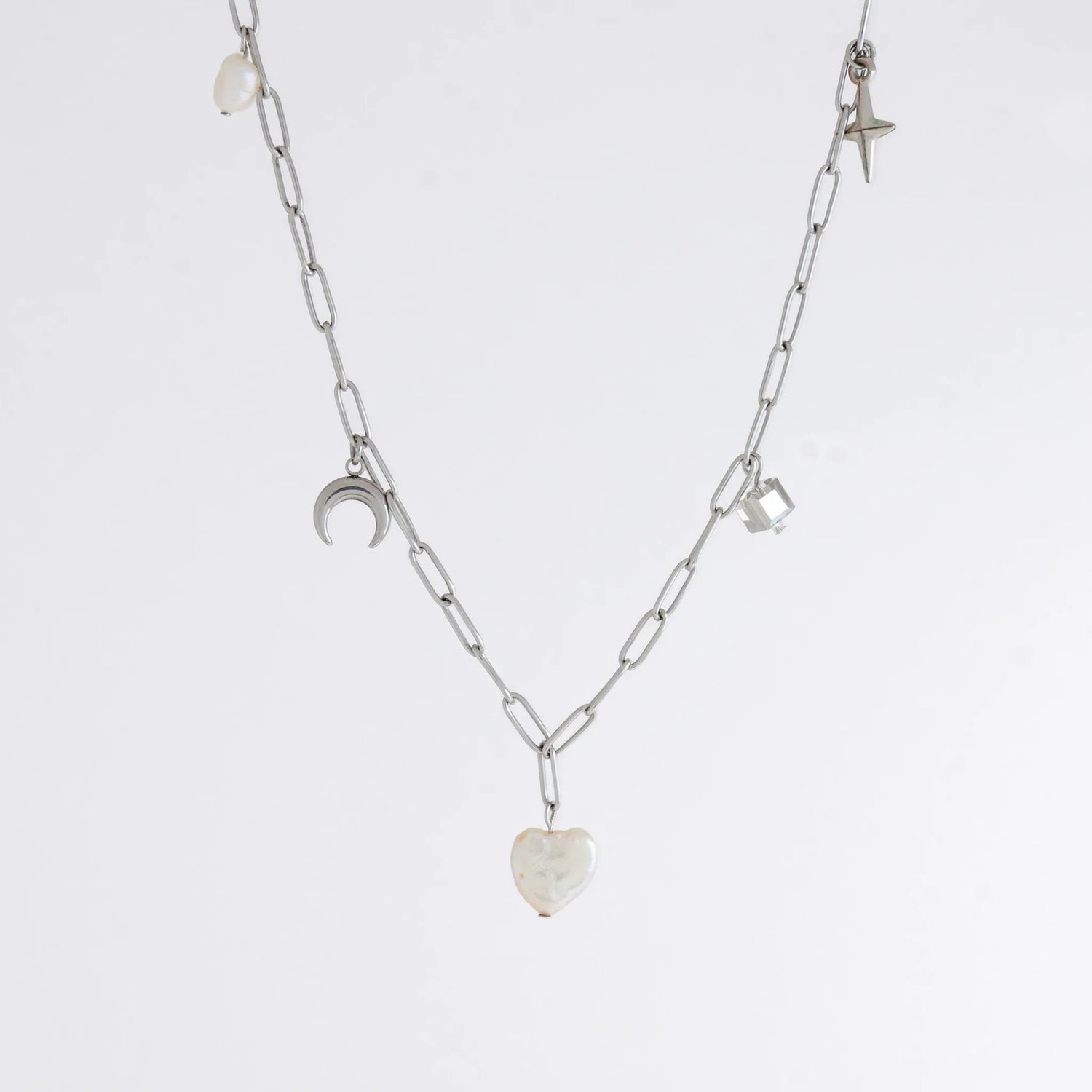 Silver charm necklace with heart pearl and celestial charm