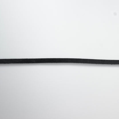 Black leather choker necklace on a light gray background