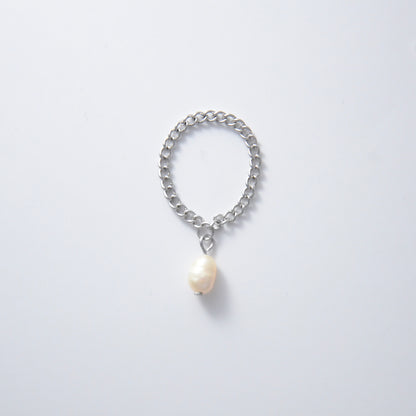 Silver stainless steel dainty chain ring with a pearl charm on a white background