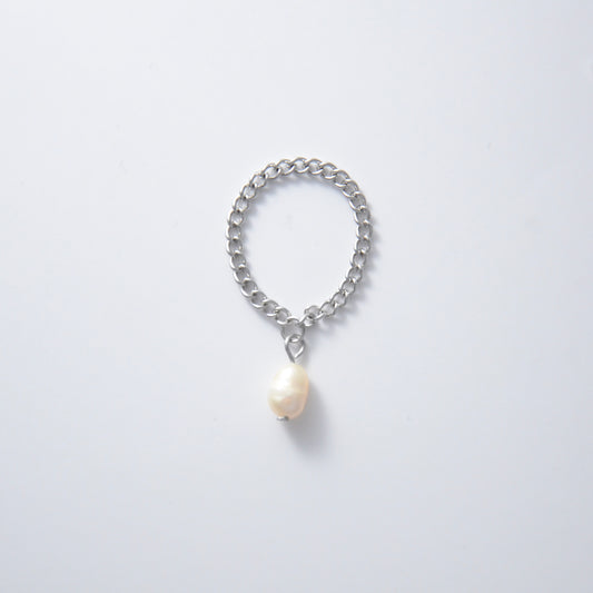 Silver stainless steel dainty chain ring with a pearl charm on a white background