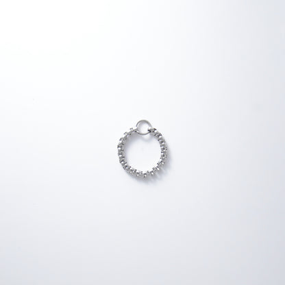 Silver stainless steel box chain ring on a light gray background non-tarnish geometric shape