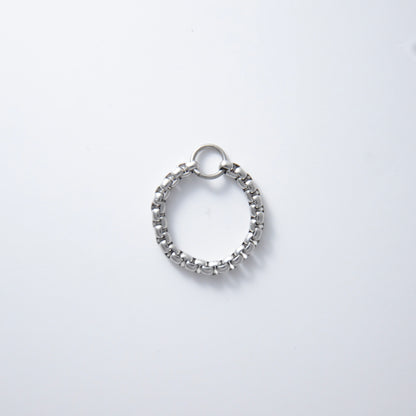 Silver stainless steel braided box chain ring on a white background