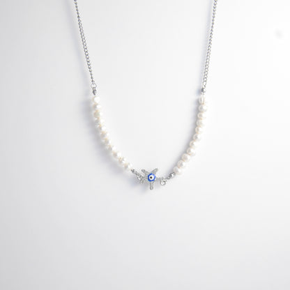 Silver stainless steel pearl choker necklace with a silver star evil eye pendant on a light gray background