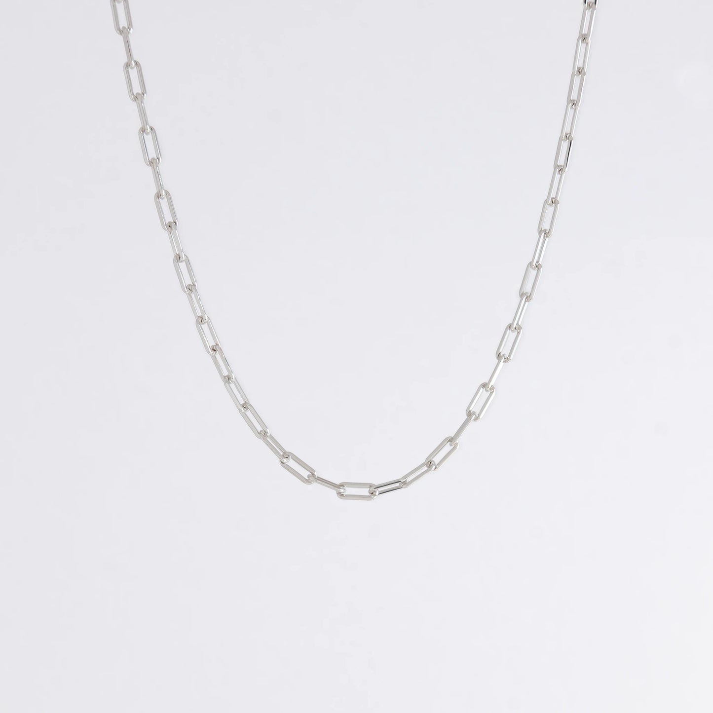 sterling silver paperclip necklace on a white background