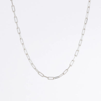 Paperclip chain necklaces on a light gray background