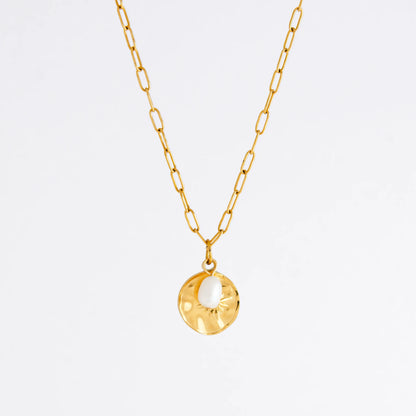 Gold paperclip necklace non-tarnish with a round sun pendant and a pearl on a light gray background