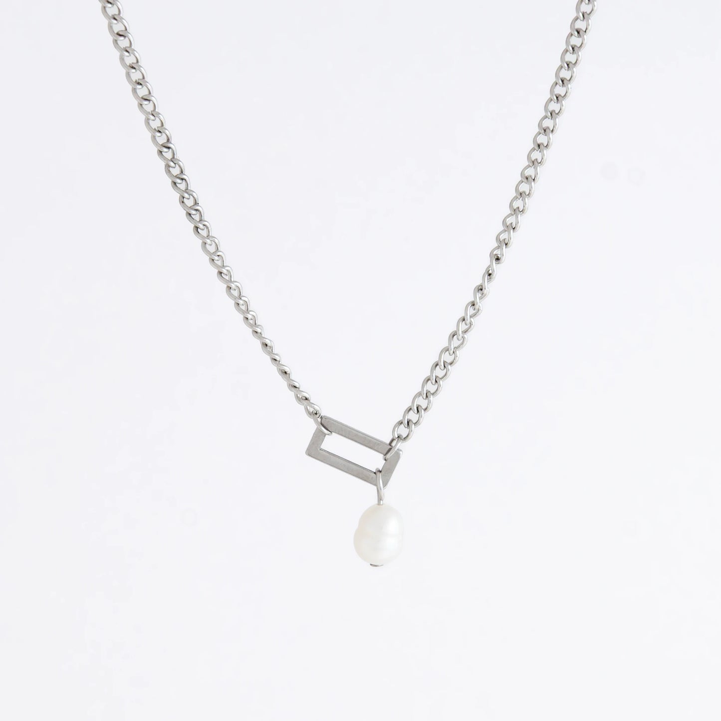 Silver necklace with a geometric shape and pearl pendant