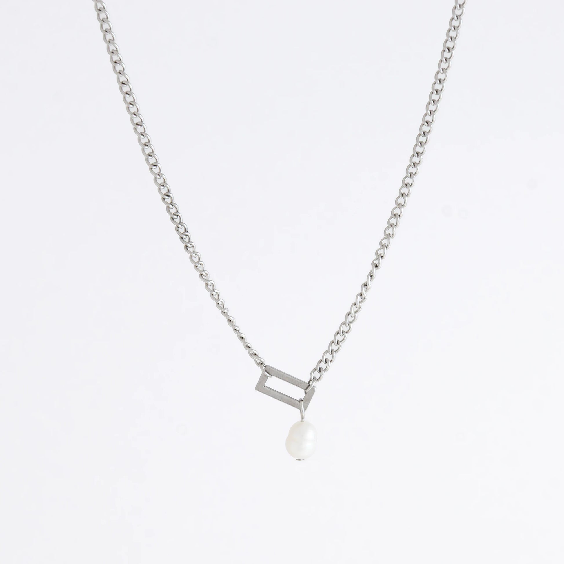 Silver necklace with a geometric shape and pearl pendant
