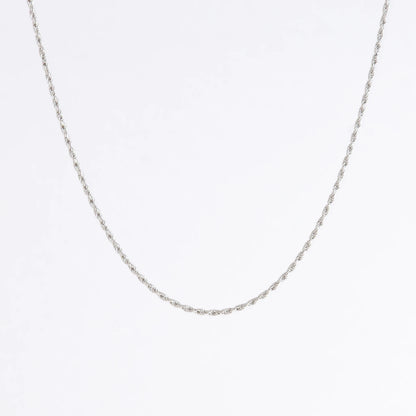 Sterling silver rope chain on a light gray background