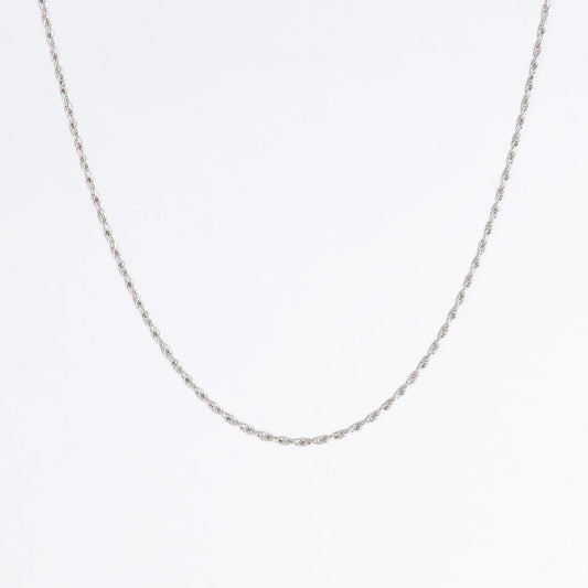 Sterling silver rope chain on a light gray background