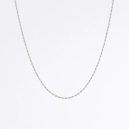 Sterling silver rope chain on a light gray background