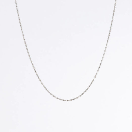 Sterling silver rope chain on a light gray background