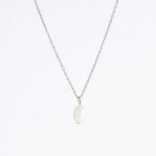 Silver dainty pearl necklace with freshwater pearl charm on a light gray background