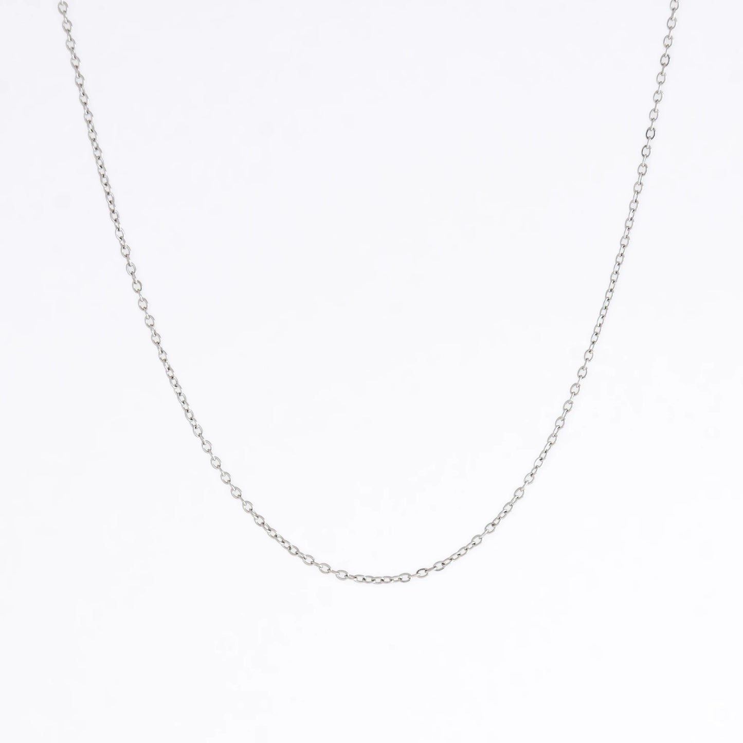 Silver stainless steel dainty chain necklace on a light gray background