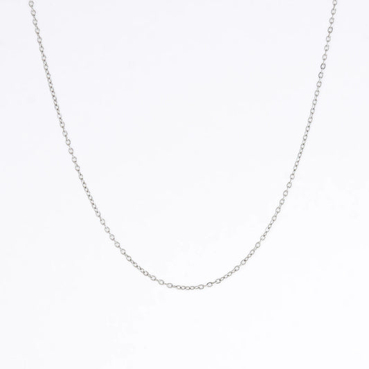 Silver stainless steel dainty chain necklace on a light gray background