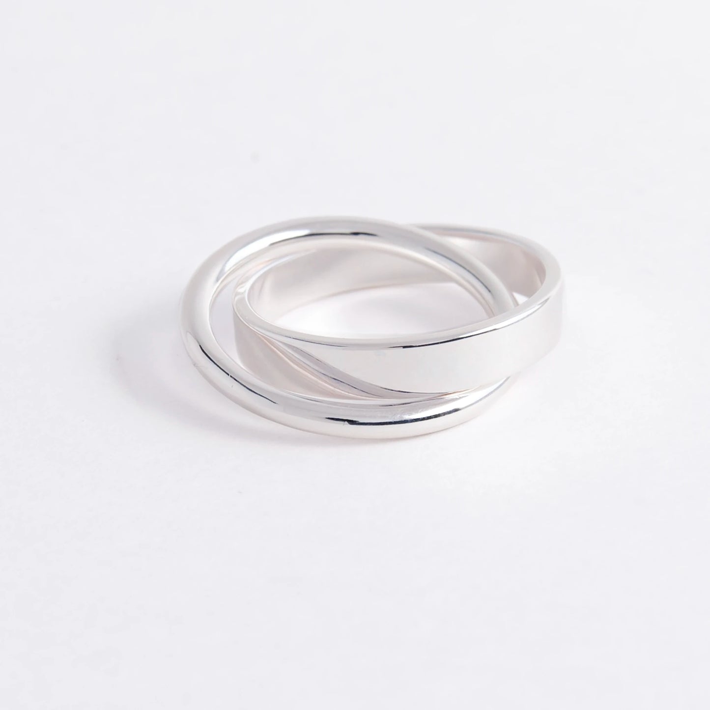 Silver ring on a light gray background