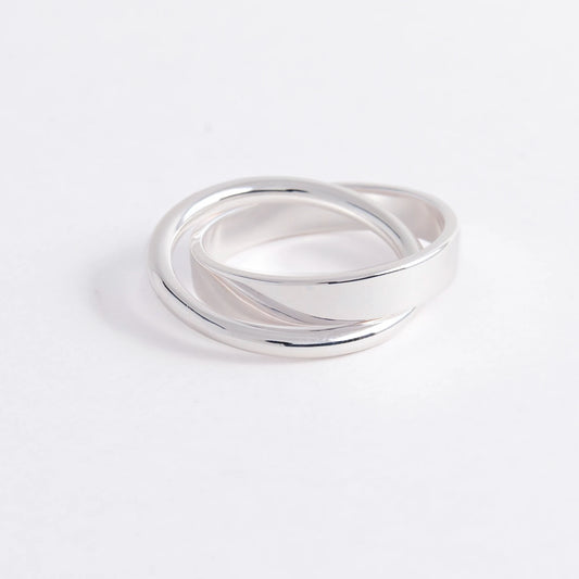 Silver ring on a light gray background
