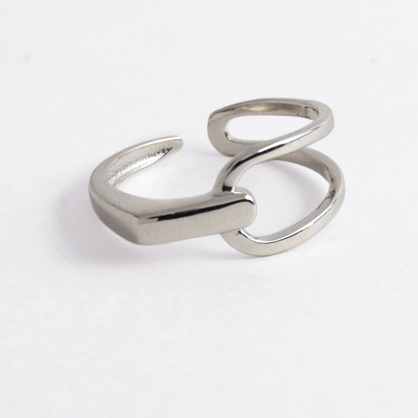 Geometric sterling silver ring on a light gray background