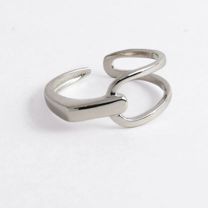 Geometric sterling silver ring on a light gray background