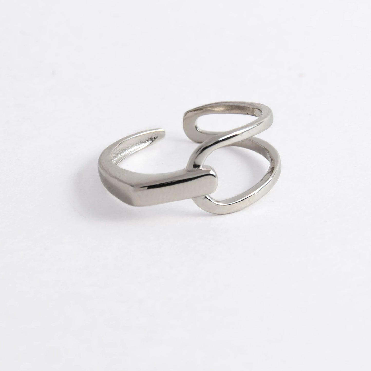 Geometric sterling silver ring on a light gray background