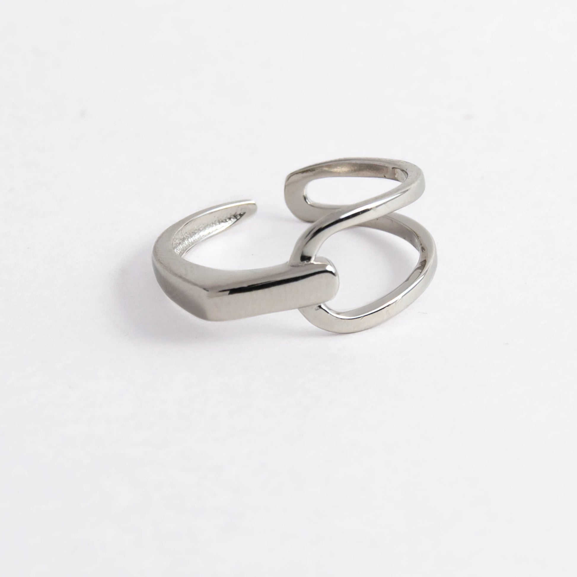 Geometric sterling silver ring on a light gray background