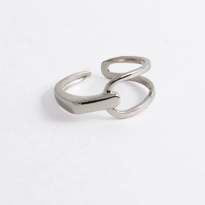 Geometric sterling silver ring on a light gray background