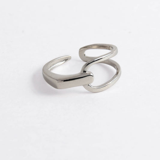 Geometric sterling silver ring on a light gray background