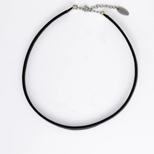 Black leather choker necklace on a light gray background