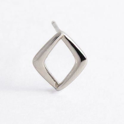 Pair of silver square earrings on a light gray background