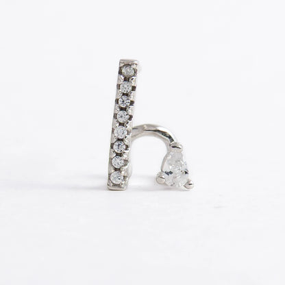 Pair of silver bar earrings on a light gray background