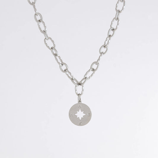 Silver layered paperclip necklaces non-tarnish with compass charm on a light gray background