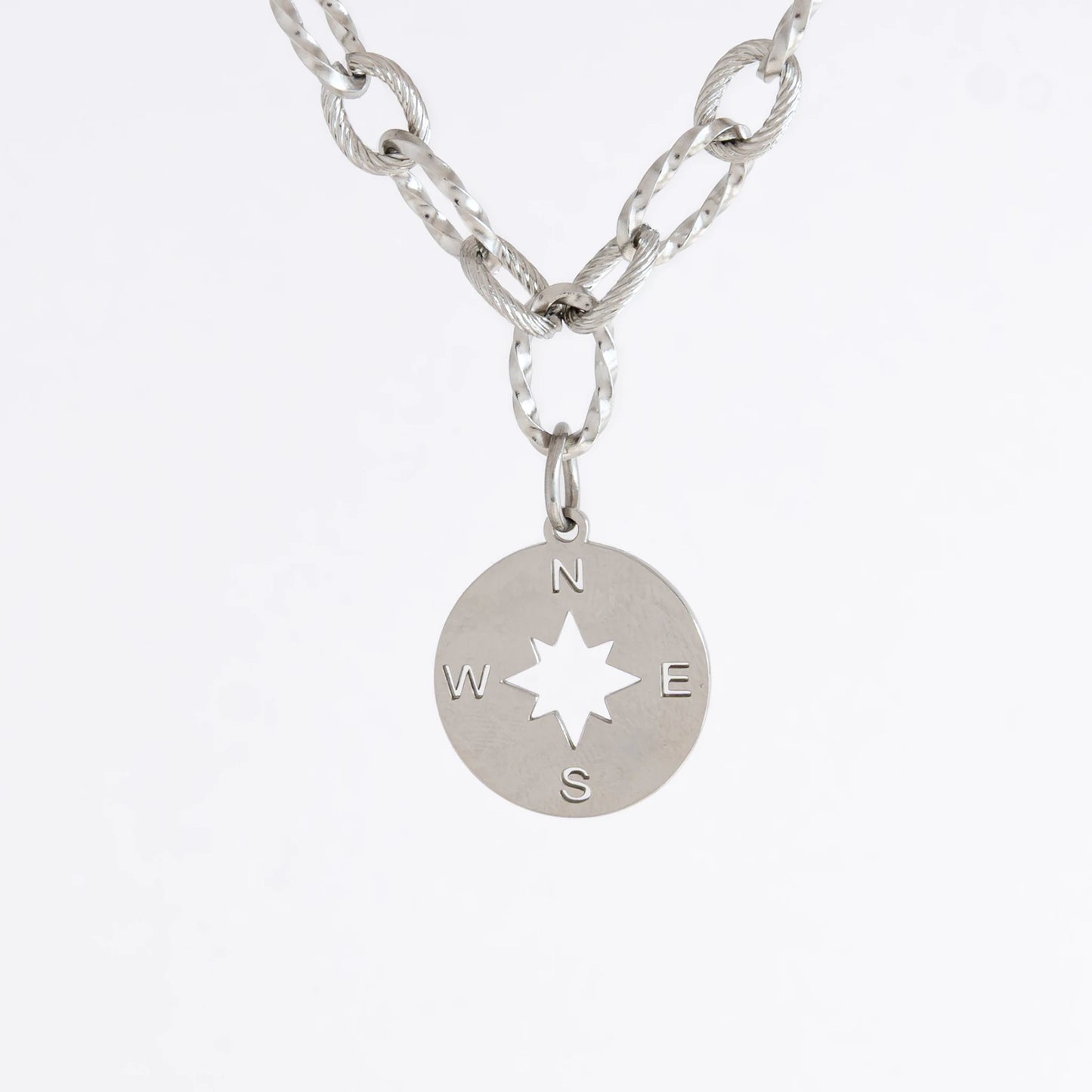 Silver layered paperclip necklaces non-tarnish with compass charm on a light gray background