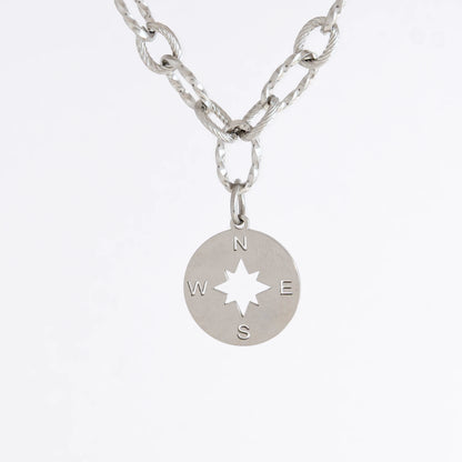 Silver layered paperclip necklaces non-tarnish with compass charm on a light gray background