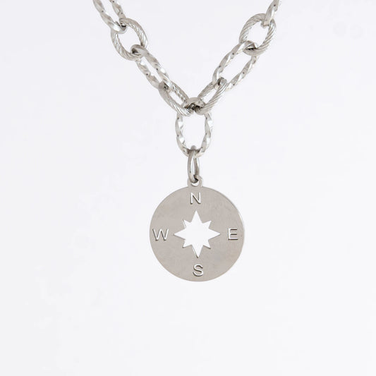 Silver layered paperclip necklaces non-tarnish with compass charm on a light gray background