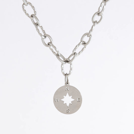 Silver layered paperclip necklaces non-tarnish with compass charm on a light gray background