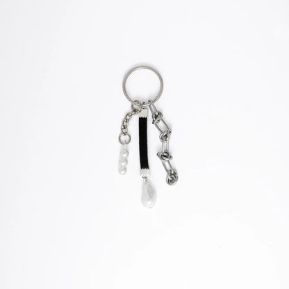 Keychain with multiple charms on a white background