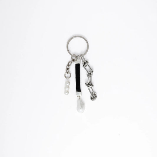 Keychain with multiple charms on a white background