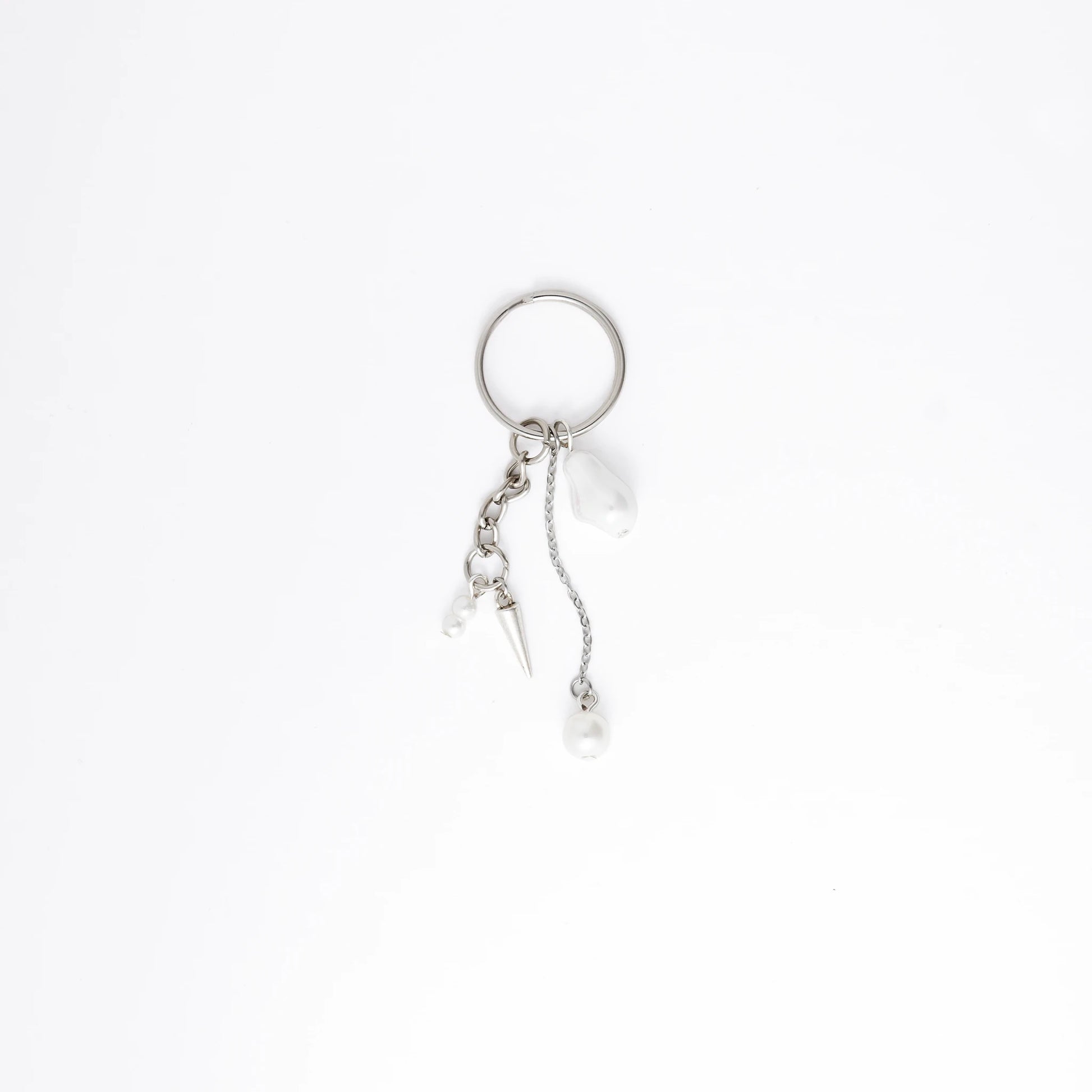 Silver keychain with a small dagger charm on a white background