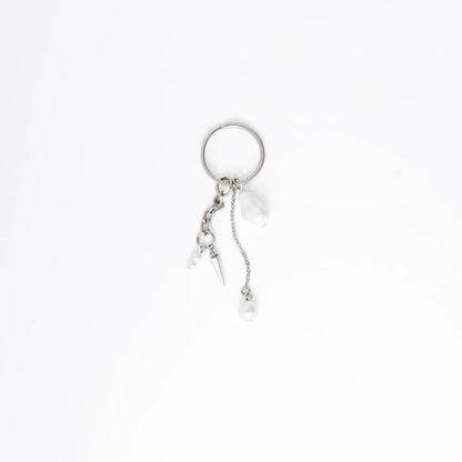 Silver keychain with a small dagger charm on a white background